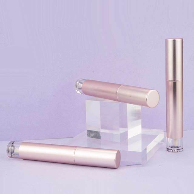 Round gold lipgloss tube