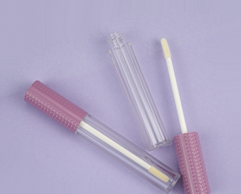 Round clear lipgloss tube with unique plastic cap