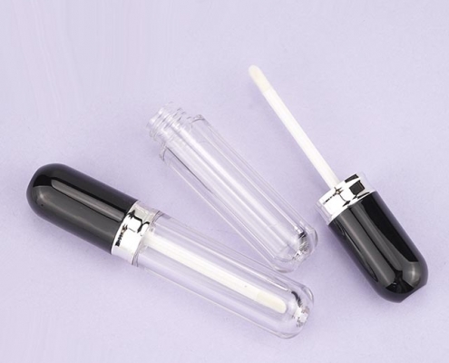 Lipgloss tube with shiny black cap