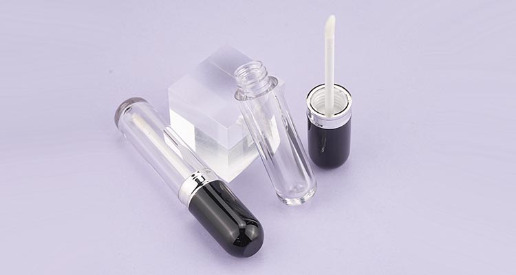 Lipgloss tube with shiny black cap