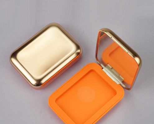 Orange face compact powder case