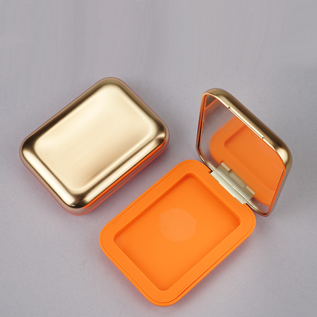 Orange face compact powder case