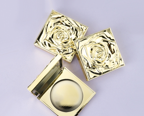 Luxury gold compact powder case with rose cap