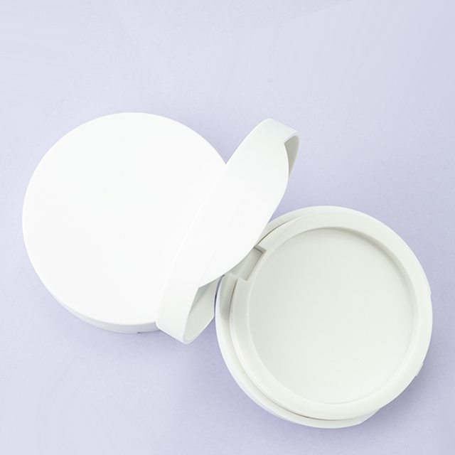 White compact powder case with puff