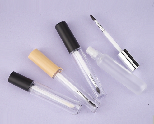 Eyebrow cream tube with brush, lipgloss tube