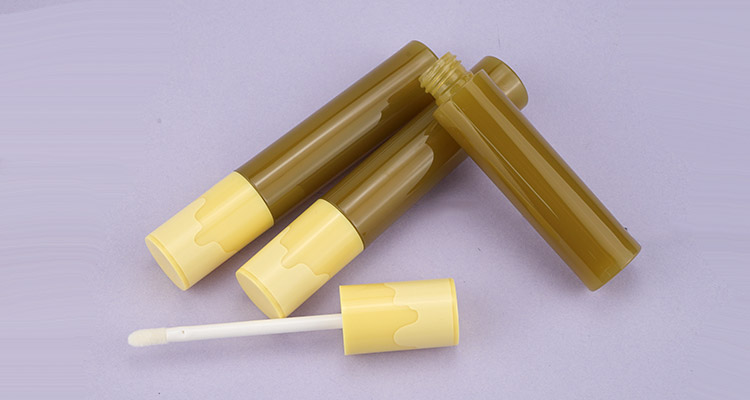 Colorful lipgloss tube with yellow wand cap