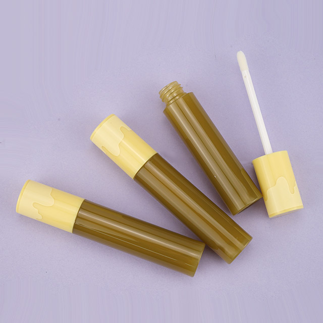 Colorful lipgloss tube with yellow wand cap