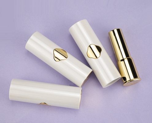 Lipstick tube with click button